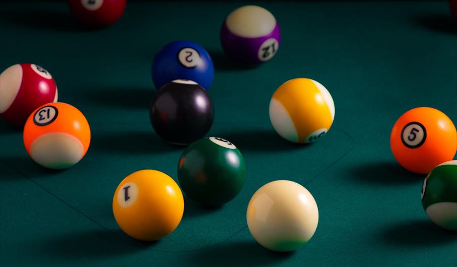 billiard balls on a billiard table